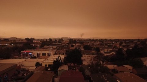 An expansive view of a Richmond neighborhood covered by an orangish- and brownish-colored sky.