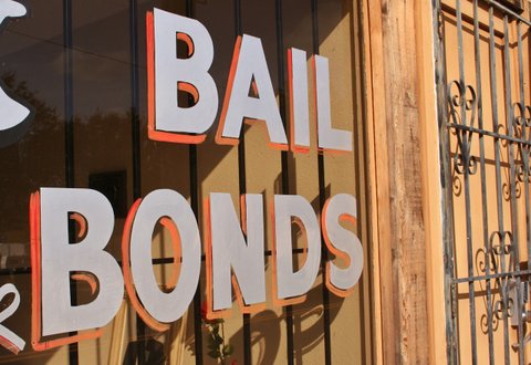Storefront with "BAIL BONDS" painted in the window