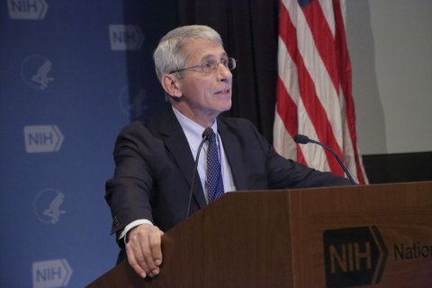Dr. Anthony Fauci at a lectern.