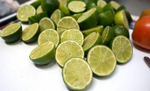 Several limes, cut in half