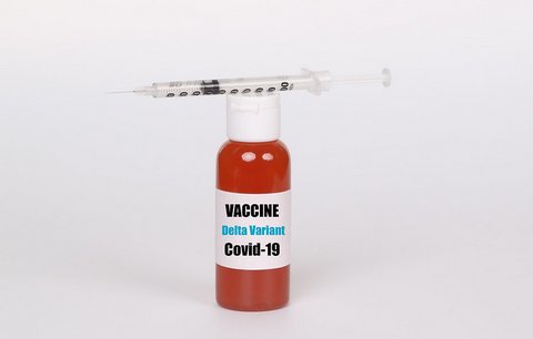 Small bottle superimposed with the words "vaccine delta variant covid-19" and a syringe on top
