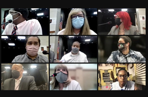 Nine people in virtual meeting, eight wearing masks
