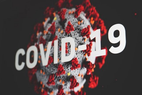 Image of a virus cell superimposed with text that says "COVID-19"