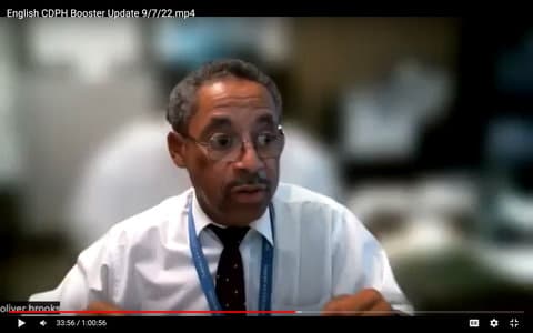 Screenshot of a Black man with graying hair, glasses and a tie. Text on screen reads "English C D P H Booster Update 9/7/22"