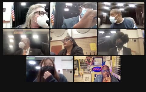 Eight people in a virtual meeting. Six of them are wearing masks.