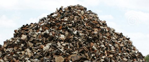 Large heap at a scrap yard with catalytic converters