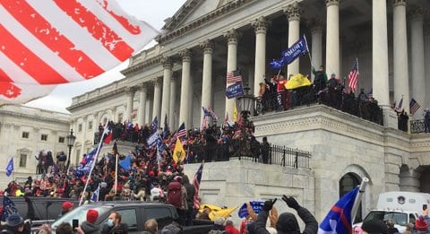 Crowd with Trump, U.S. and Don't Tread on Me flags in front of the Supreme Court building during the Jan. 6, 2021, insurrection
