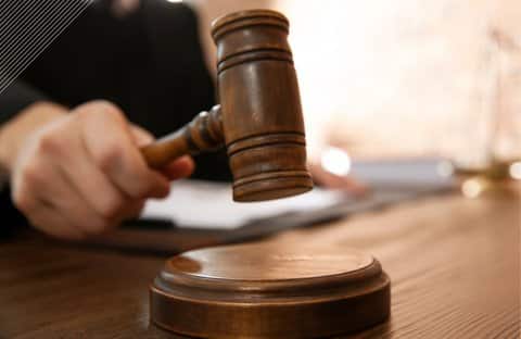 Close-up of a gavel in use