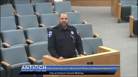 Police officer in uniform at microphone. Text that reads. Presentation Antioch Police Department City of Antioch Council meeting