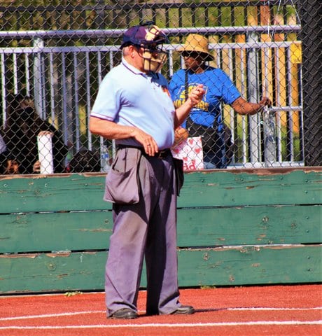 Home plate umpire standing on the field
