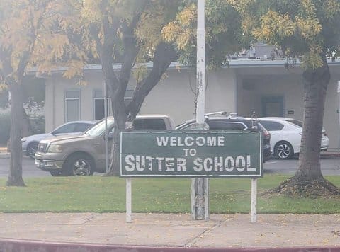 Sign that reads welcome to sutter school