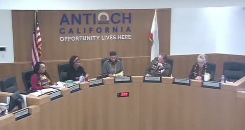 Antioch City Council meeting. The members are, seated from left, two black women, a black man, a white man and a white woman