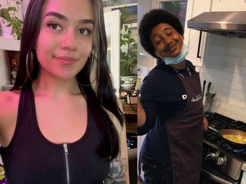 Side by side photos: At left a fair-skinned young woman wearing a zip front black tank top. At right a young Black man standing at a stove with a pan of food on. He is wearing an apron and medical mask pulled below his chin and smiling at the camera.
