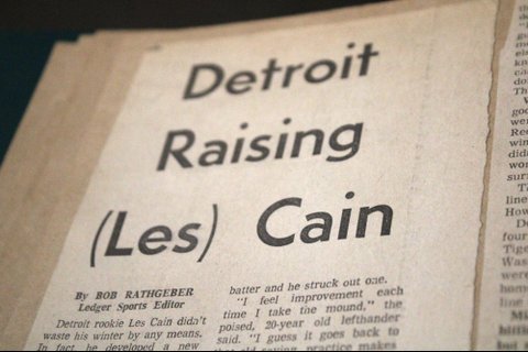 newspaper clipping with headline detroit raising (les) cain
