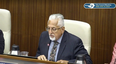 older latino man with gray hair and goatee in glasses and suit. text: richmond city council meeting wed august 14 2024