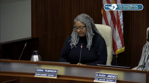 black woman with gray hair with nameplate that identifies her as doria robinson council member district 3, on screen text reads richmond city council meeting tue october 1 2024