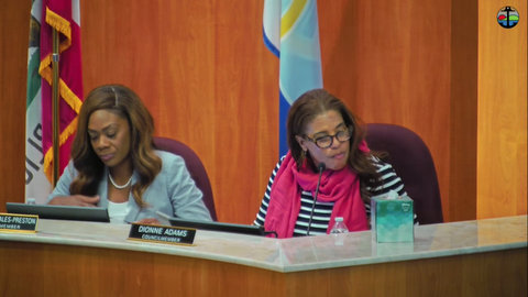 two black women on a city council