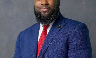 a black man in suit and tie