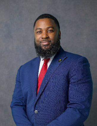 a black man in suit and tie