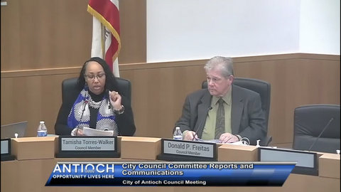 black woman and white man in government meeting