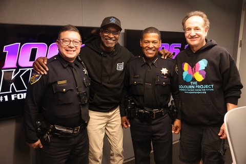 latino man in police uniform, black man, black man in police uniform, white man, standing together and smiling