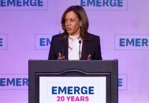 kamala harris at lectern that says emerge 20 years