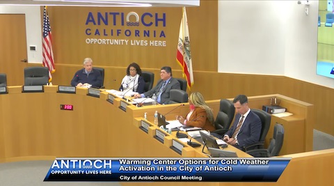 two black women and three men. they are three antioch city council members and city staff. behind them is US and california flags and antioch california opportunity lives here on the wall. onscreen text reads antioch opportunity lives here. warming center options for cold weather activation in the city of antioch. city of antioch council meeting