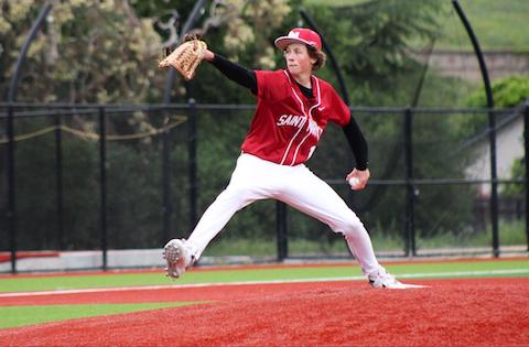 high school pitcher on the mound wearing red St. Mary's jersey, red cap and white pants