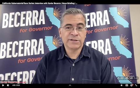 javier becerra. background says becerra for governor repeatedly with illustrations of the state of california and the sun peeking out from it. onscreen text reads california gubernatorial race series interview with xavier becerra, news briefing